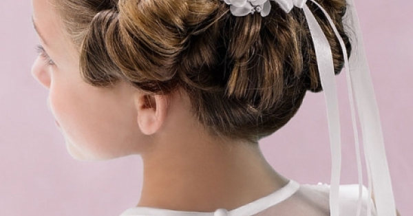 Girl in communion dress showing hairstyle. Stock Photo by ©karelnoppe  45448647